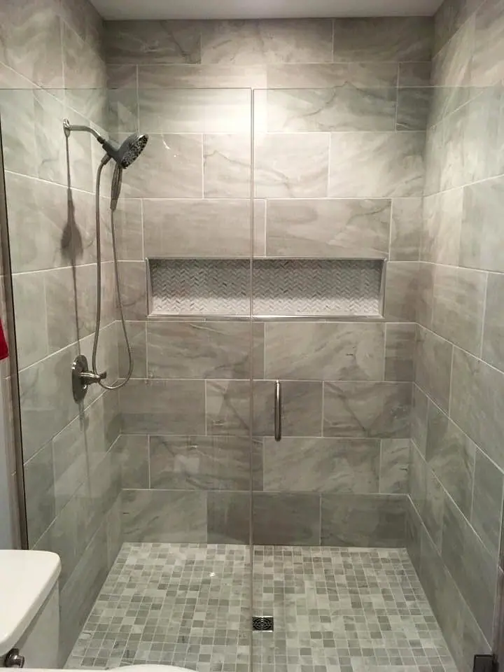 Large-format tile walk-in shower with niche