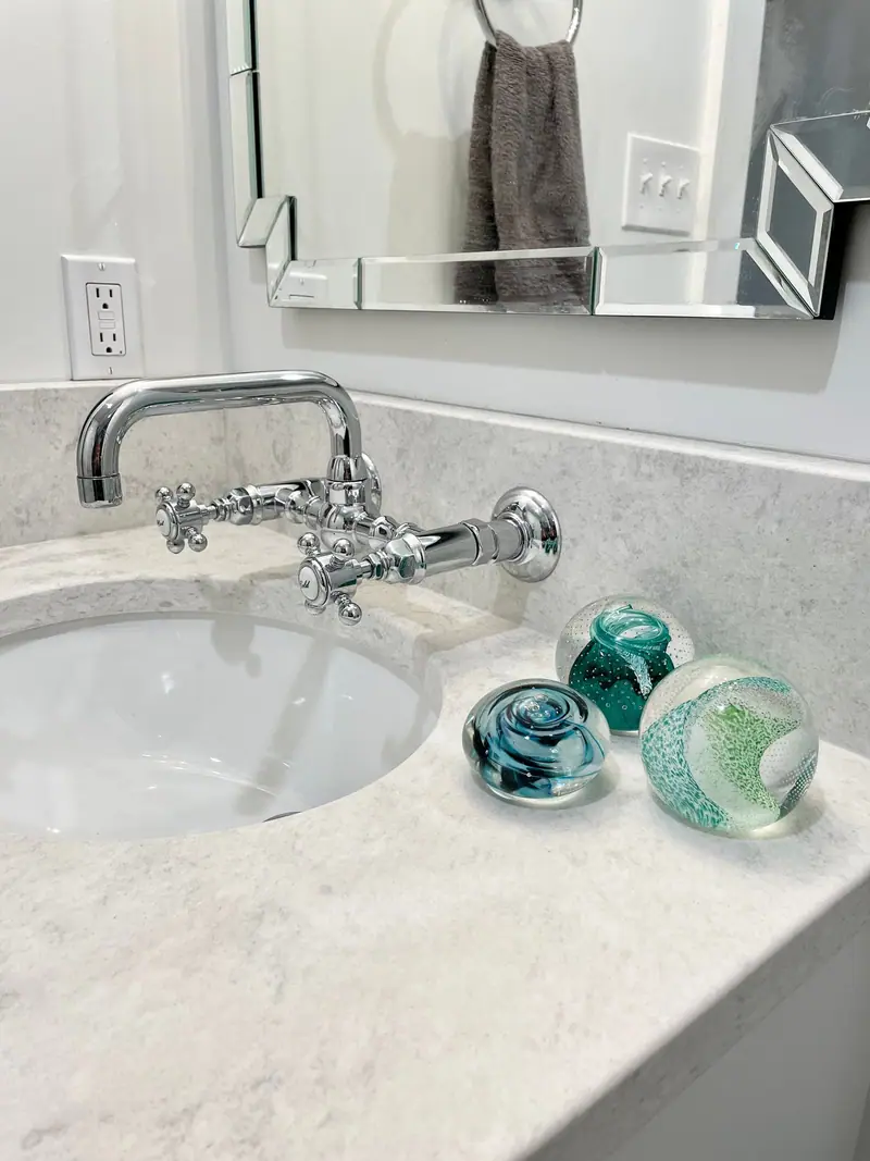 Vanity sink with wall-mount bridge faucet