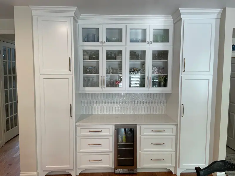 Glass-front cabinets and built-in beverage center