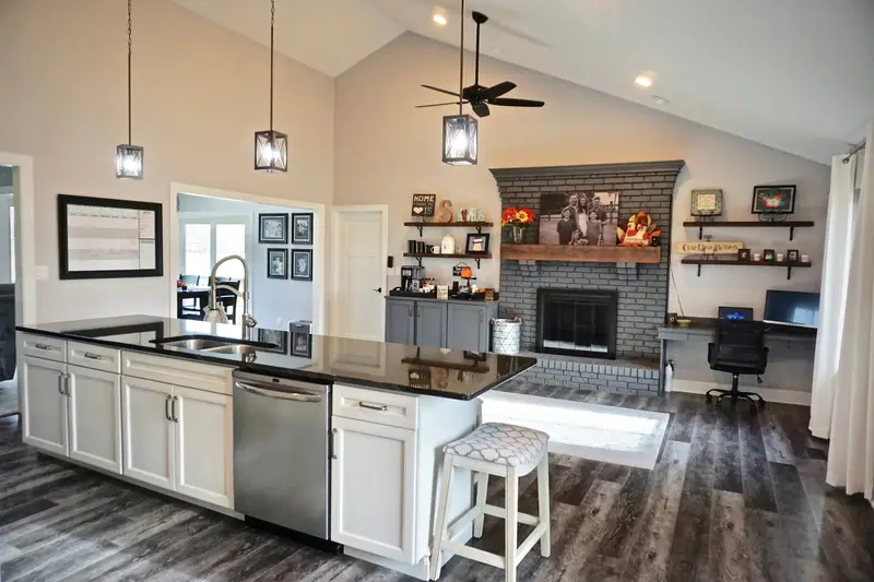 Open kitchen and living area with vaulted ceiling