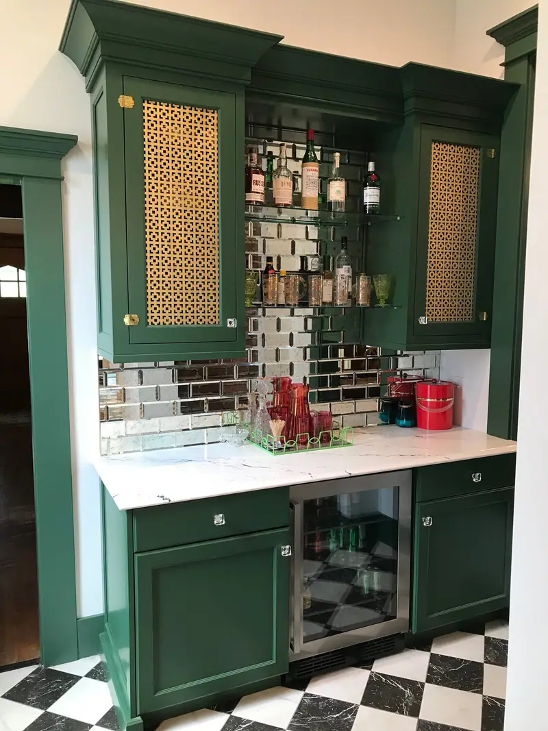 Green cabinetry coffee bar with mirrored backsplash