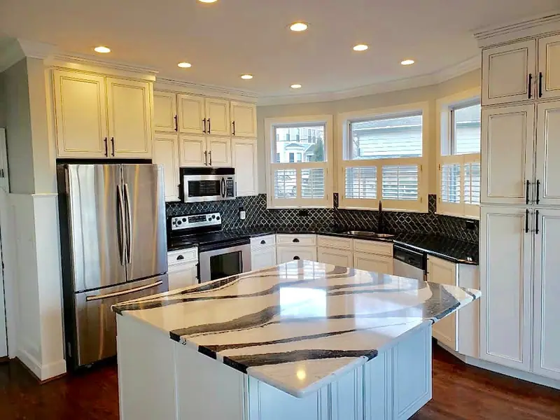 Kitchen with patterned island countertop and window seating area