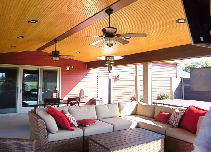 Covered porch with wood ceiling, ceiling fans and outdoor seating
