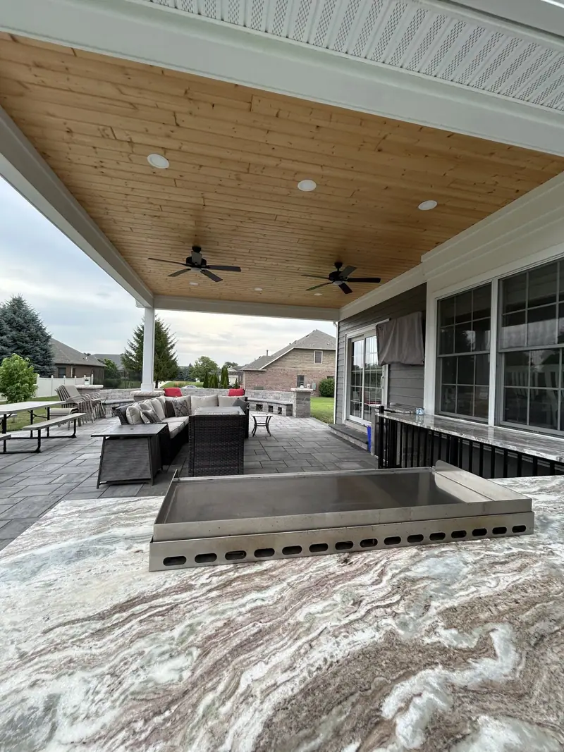 Covered outdoor living area with fire table