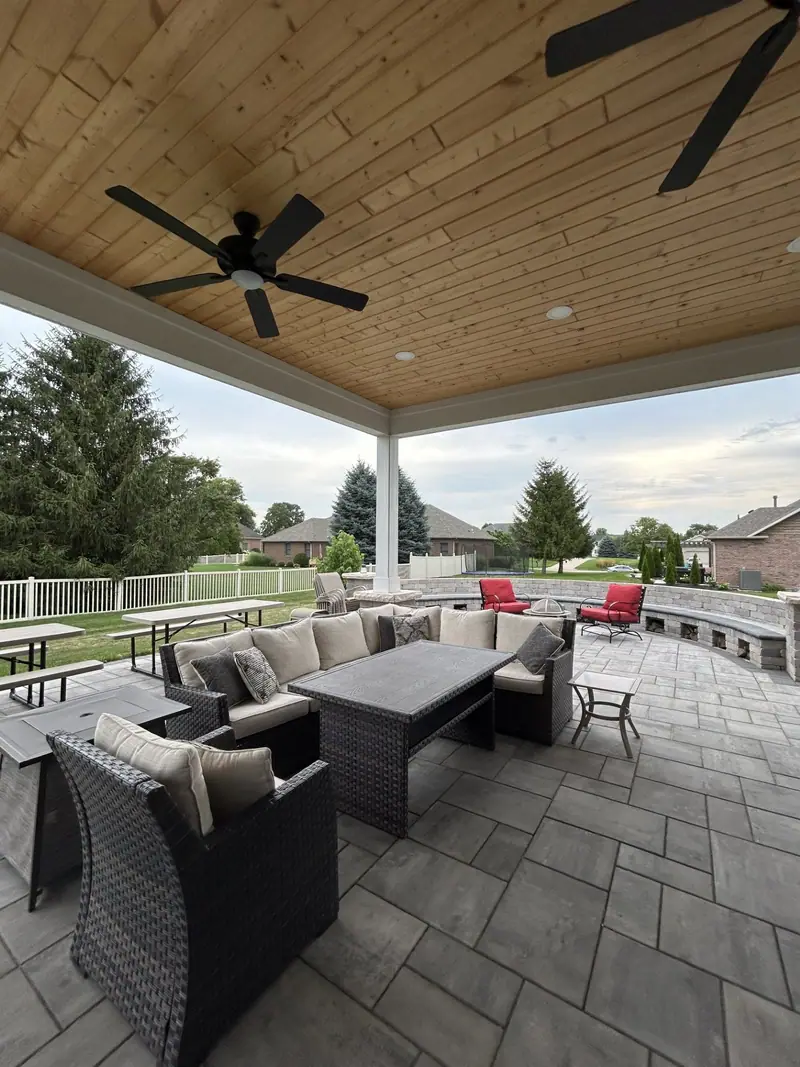 Covered patio with wood ceiling and paver floor