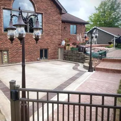 Stamped concrete patio with lamp posts