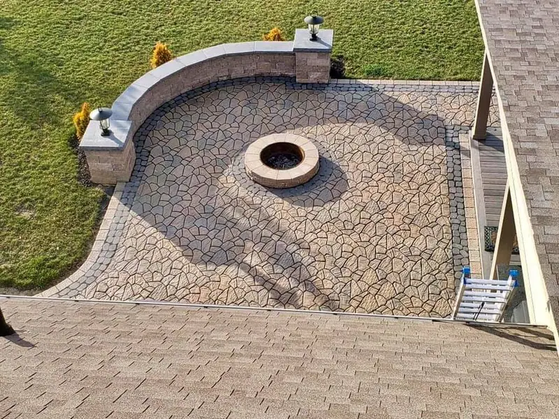 Paver patio with built-in fire pit and seat wall