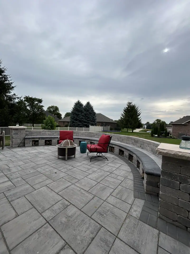 Paver patio with curved seat wall