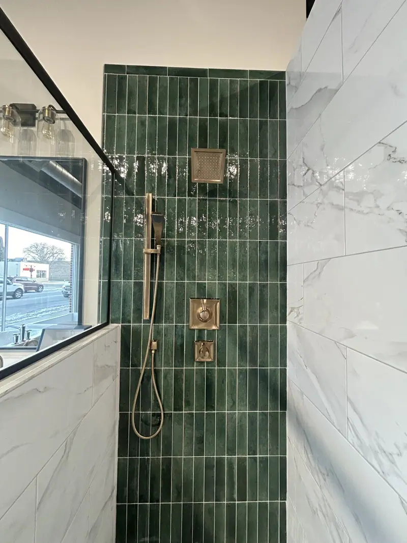Showroom shower display with green glazed tile