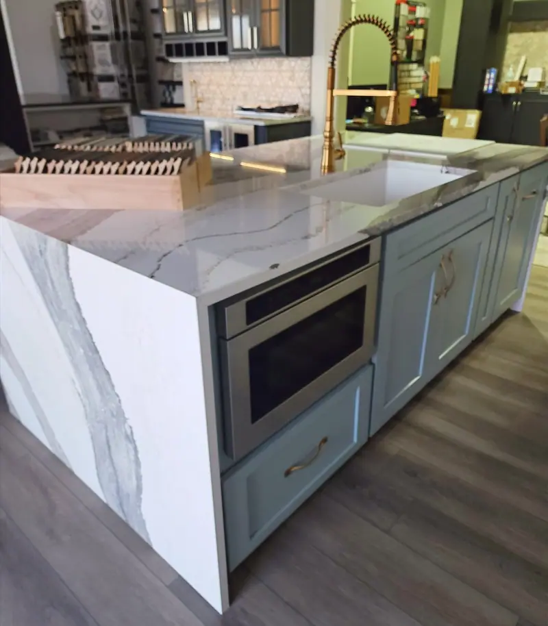 Showroom display island with waterfall quartz edge